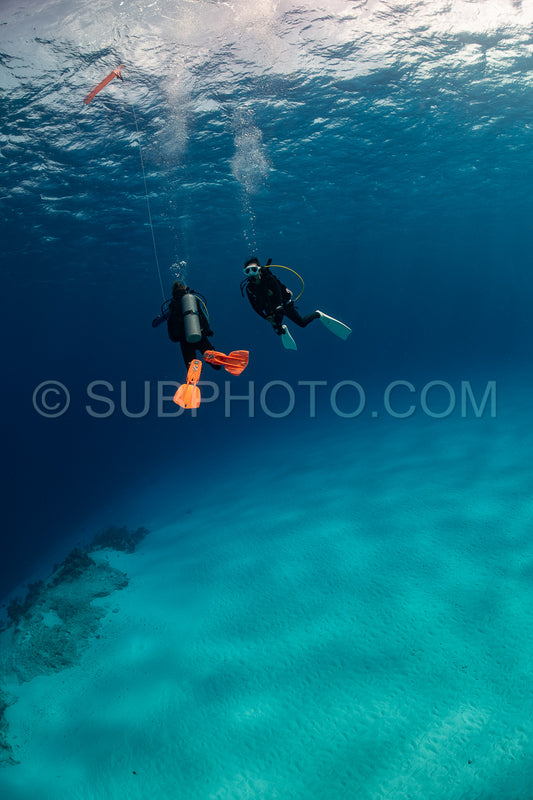 woman scuba diving on Cozumel coral reef in Mexico