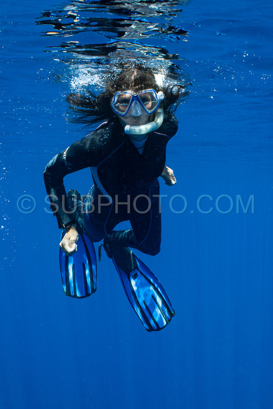 woman snorkeling in polynesian deep waters