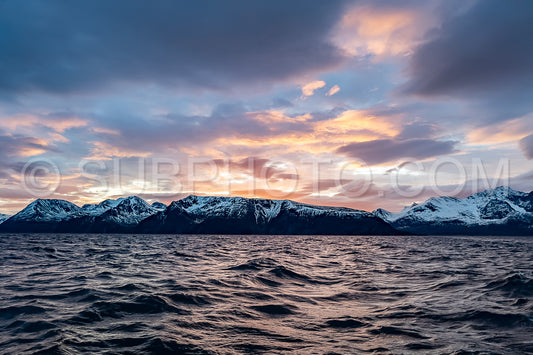 view of KvÃ¦nangen fjord from Seglvik village at dusk