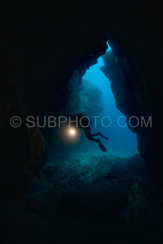 woman diver visiting a cave
