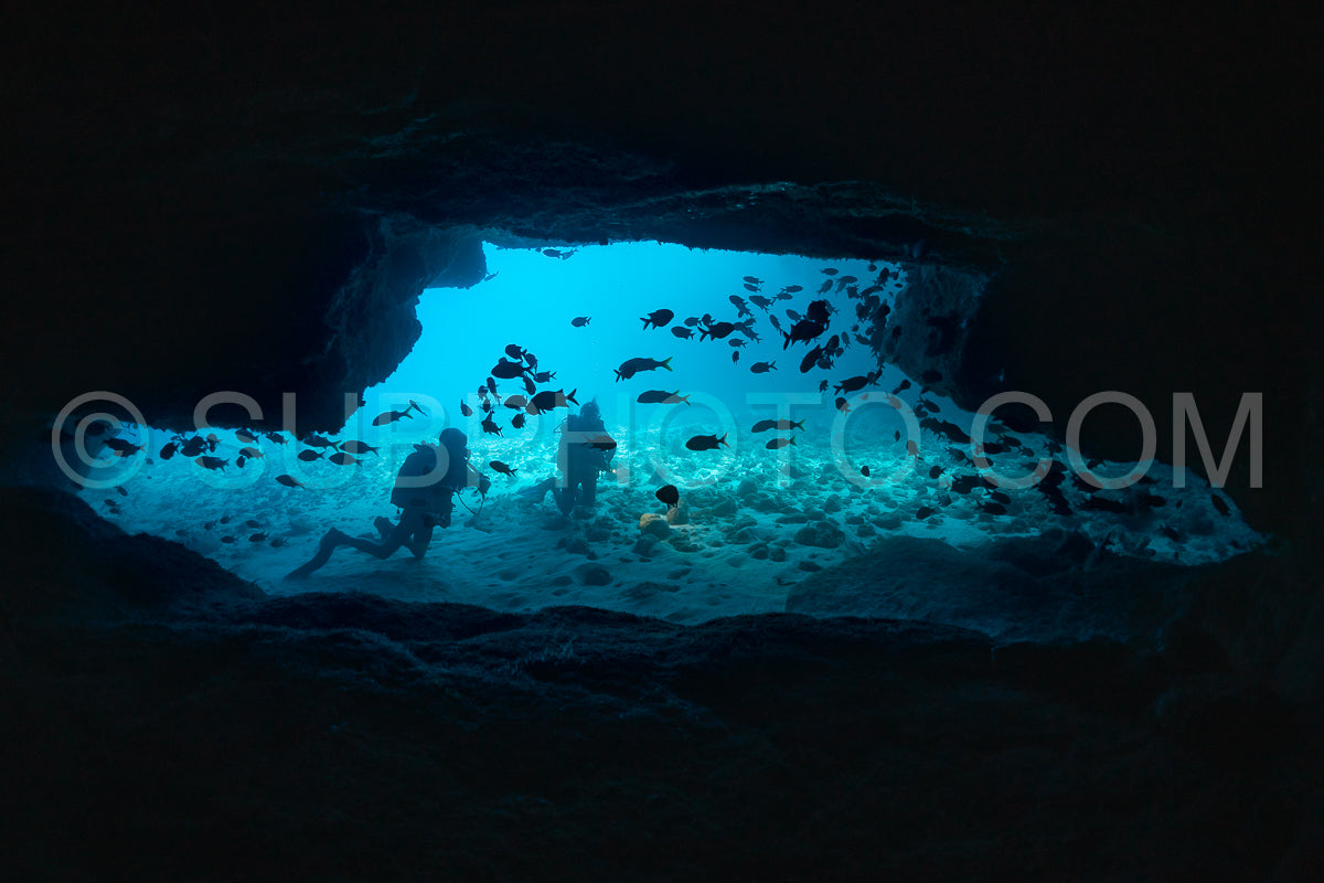 woman diver visiting a cave