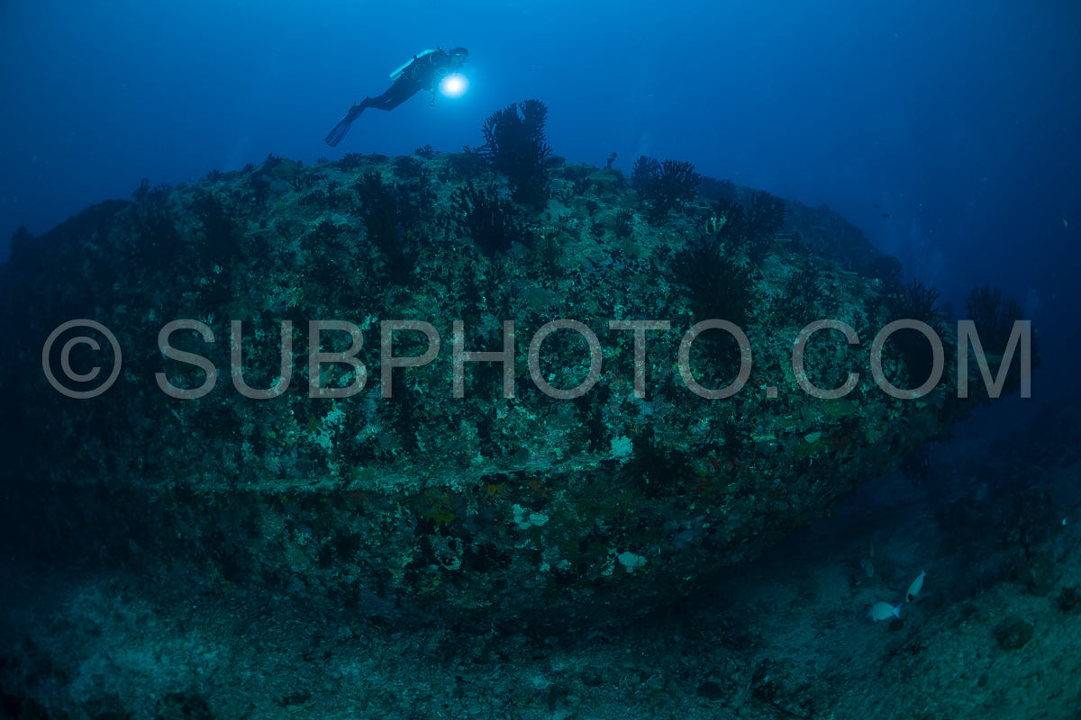 diver over a ship wreck in the Maldives