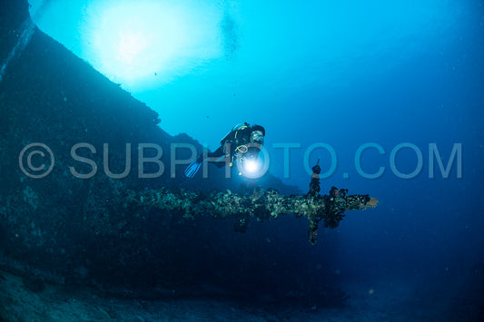 diver over a ship wreck in the Maldives