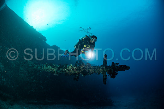 diver over a ship wreck in the Maldives