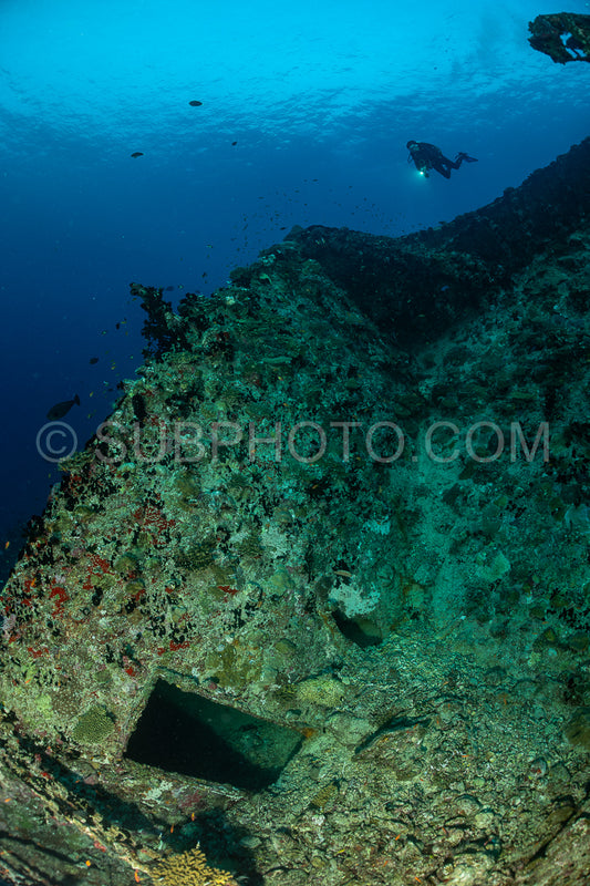 diver over a ship wreck in the Maldives