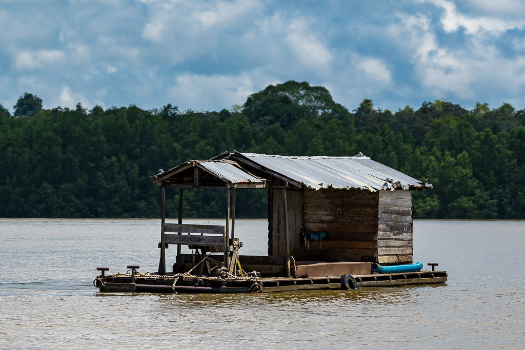 Floating wooden fishing hut with tin roof on a bamboo raft, Maratua, Kalimantan (Borneo), Indonesia