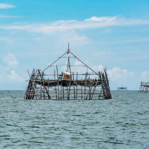 Bamboo bagang fishing platform with another in the distance on calm sea, Maratua, Kalimantan (Borneo), Indonesia
