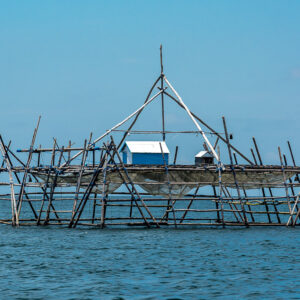 Bagang platform with small blue hut and nets, clear blue sky, Maratua, Kalimantan (Borneo), Indonesia