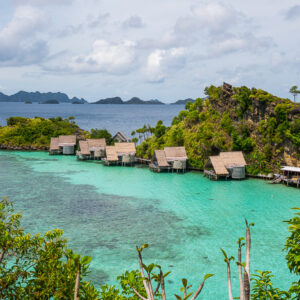 Elevated view over lagoon and overwater bungalows with distant islands, Misool, Raja Ampat, Indonesia
