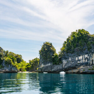 Undercut mushroom karst islets reflected in still water, Misool, Raja Ampat, Indonesia