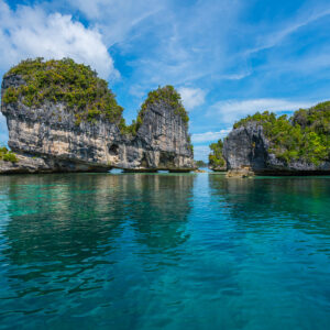 Karst islets and their reflections on a mirror-calm sea, Misool, Raja Ampat, Indonesia