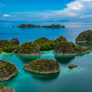 Aerial-style view of mushroom-shaped islets in shallow lagoon, Waigeo, Raja Ampat, Indonesia