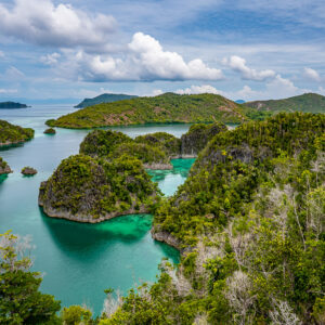 Viewpoint over forested karst islets under billowing clouds, Waigeo, Raja Ampat, Indonesia