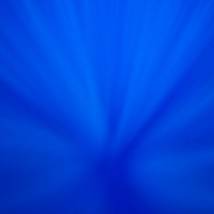 Sun rays converging into the deep blue ocean, looking down from the surface, Society Islands, French Polynesia