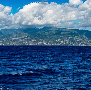 Panoramic view of a mountainous island on the horizon under clouds, Tahiti, Society Islands, French Polynesia