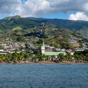 Seafront with palm trees, a white church and hillside houses, Tahiti, Society Islands, French Polynesia