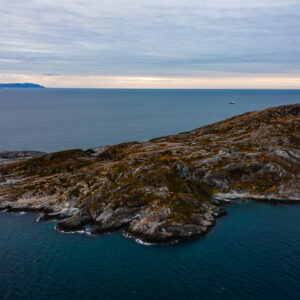 Aerial view of a rocky headland jutting into the fjord, Seglvik, Troms, Norway