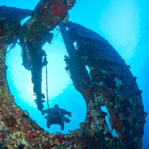 Rebreather diver framed by the stern of the Levanzo wreck, Red Sea, Egypt