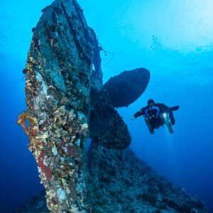 Rebreather diver beside the rudder and propeller of the Levanzo wreck, Red Sea, Egypt