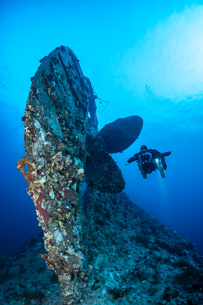 Rebreather diver beside the rudder and propeller of the Levanzo wreck, Red Sea, Egypt