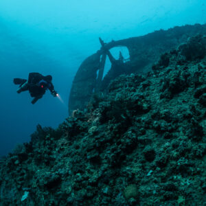 Rebreather diver swimming along the hull of the Levanzo wreck, Red Sea, Egypt