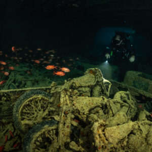 Motorcycles in a truck bed lit by a diver’s torch in a hold, Thistlegorm wreck, Red Sea, Egypt