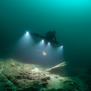Photogrammetry rig with four lights sweeping over scattered wreck debris, Saint-Malo, Brittany, France
