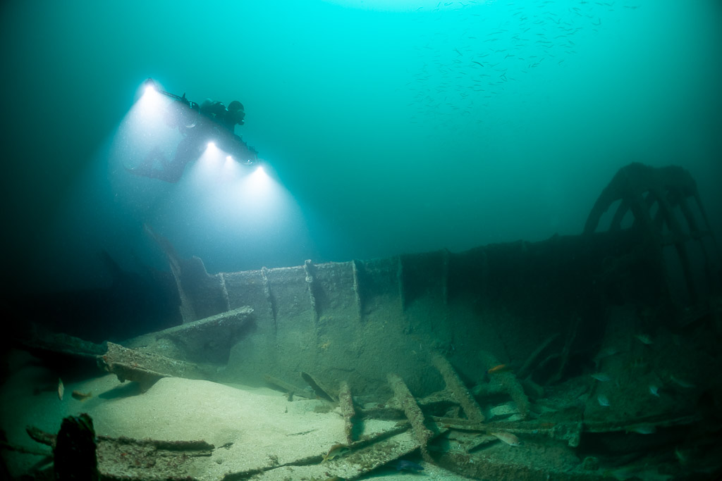 Photogrammetry lights illuminating wreck frames near a curved hull section, Saint-Malo, Brittany, France
