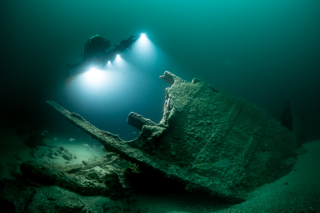 Photogrammetry lights over a tilted broken wreck section on the sand, Saint-Malo, Brittany, France
