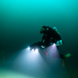 Rebreather diver close-up with photogrammetry rig, vertical framing, Saint-Malo, Brittany, France