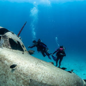 Two divers above the cockpit of a seaplane wreck, Grumman HU-16 Albatross wreck, Red Sea, Egypt