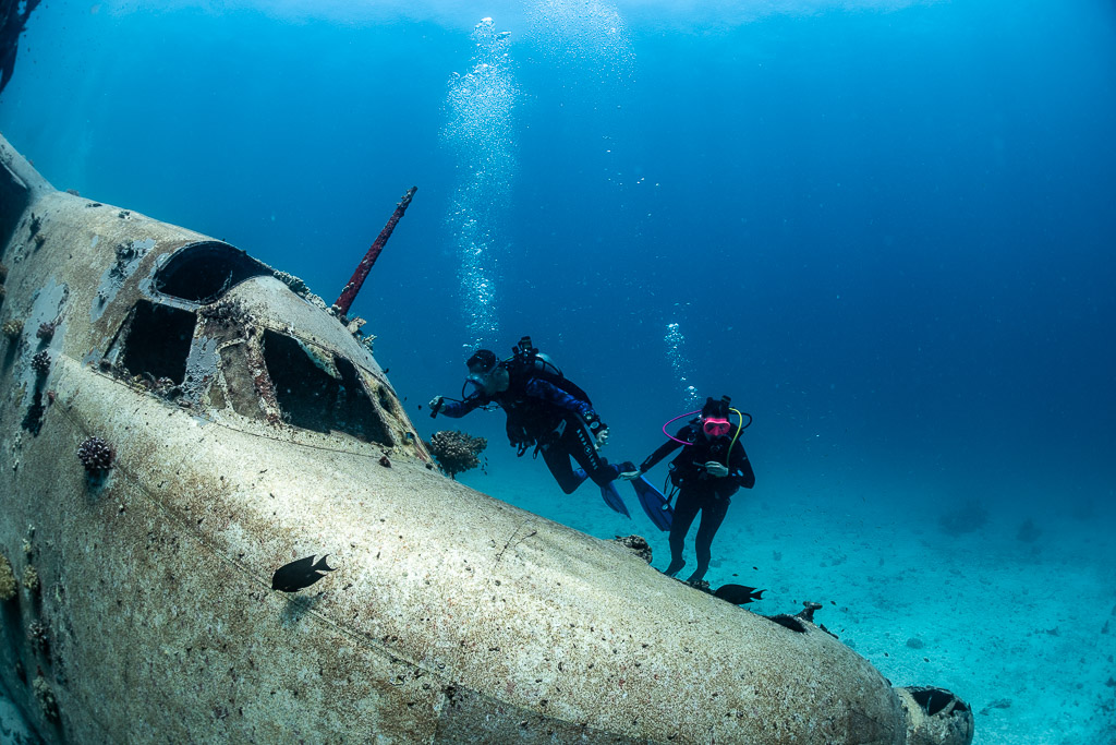 Two divers above the cockpit of a seaplane wreck, Grumman HU-16 Albatross wreck, Red Sea, Egypt