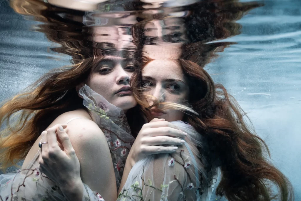 Two models embracing underwater